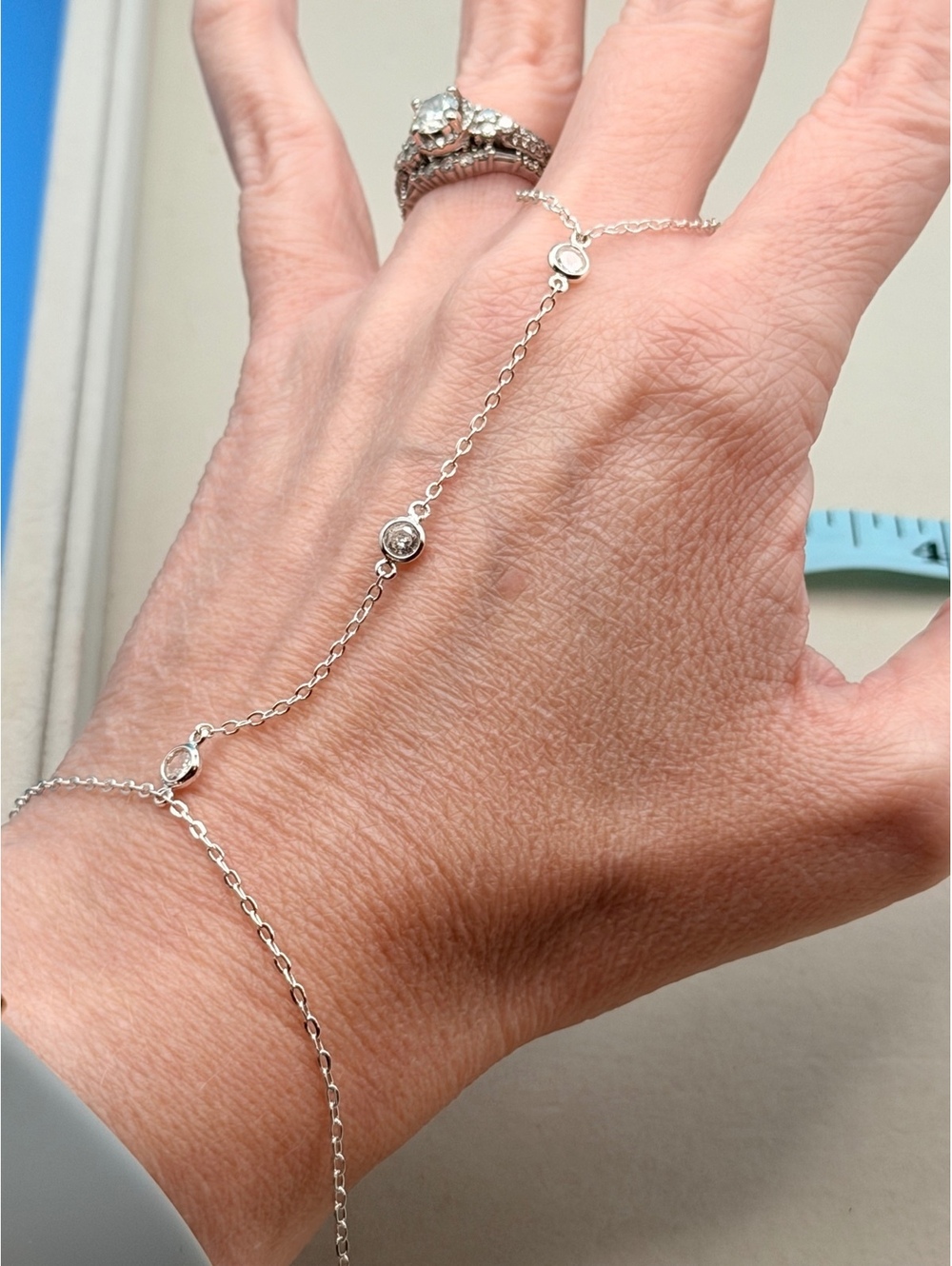 Silver tone hand chain bracelet ring
